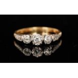 A mid 20th Century 18ct diamond three stone ring,