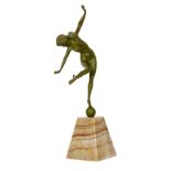 A later 20th Century reproduction bronze figure in the Art Deco style, modelled as The Snake Dancer,