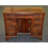 A mahogany kneehole desk in the Georgian style,