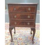 A 20th Century mahogany bedside chest of three drawers, raised to cabriole legs, width 44cm.