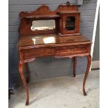 An early 20th Century ladies walnut writing desk,