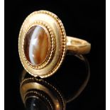 A 19th Century 22ct single stone tigers eye ring,