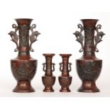 Amended description - A pair of 20th Century Chinese spelter vases in a bronzed finish,