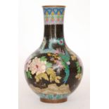 An early 20th Century Japanese cloisonne enamel vase decorated with flowers and exotic bird on a