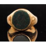 A late 19th Century 18ct hallmarked gentleman's signet ring with central sunk set oval bloodstone,