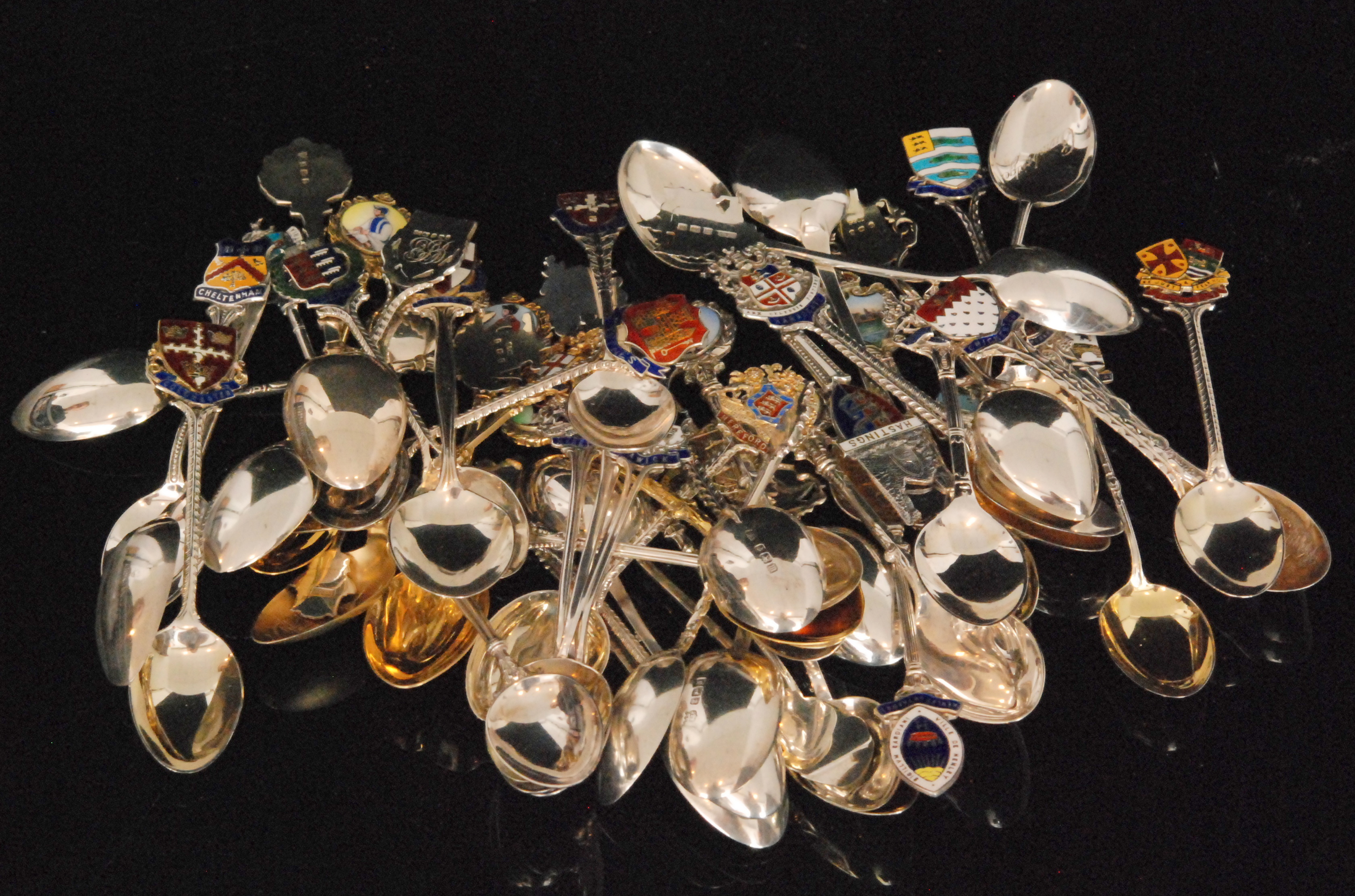 A large quantity of hallmarked silver souvenir spoons for cities mainly from the United Kingdom and