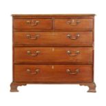 A late Georgian mahogany chest of two short over three long cock-beaded drawers,