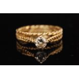 A modern 18ct hallmarked diamond solitaire ring, claw set brilliant cut stone ,