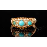 An early 20th Century 18ct turquoise and diamond boat shaped seven stone ring,