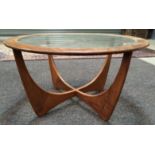 A post war G-Plan 'Astro' teak circular coffee table with inset glass top, diameter 84cm, S/D.