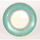 A large 1930s Susie Cooper charger decorated with a blue border rim with an incised garland and a