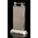 A silver plated Dunhill tallboy table lighter with rectangular engine turned shaped body,