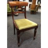 A set of six William IV mahogany yoke back dining chairs, with turned front legs.