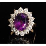 An 18ct hallmarked amethyst and diamond cluster ring,