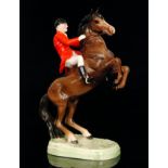 A Beswick Huntsman on rearing horse, model 868, printed oval mark,