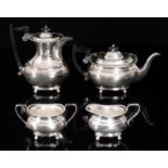 A hallmarked silver four piece boat shaped tea set of plain form terminating in egg and dart