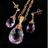 A modern amethyst pendant necklace designed as a pear shaped facet cut amethyst with beaded foliate