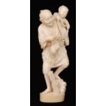 A late 19th to early 20th Century Japanese carved ivory figure of a fisherman,