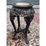 An early 20th Century Oriental Export hardwood jardiniere stand with inset marble top, height 58cm,