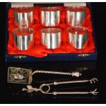 A modern cased set of six hallmarked silver napkin rings, each of plain circular form,