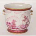 A Continental twin handled jardiniere decorated with a cerise landscape and castle ruins,