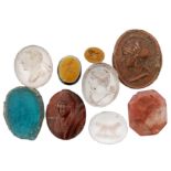 A collection of thirteen glass and crystal lozenge shaped and oval seals various portrait designs