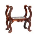 A late 19th Century mahogany stool in the Arts and Crafts style,