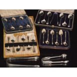 Four cased sets of hallmarked silver teaspoons together with two tablespoons, one fiddle pattern,