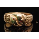 A 9ct hallmarked double head snake ring each with ruby set eyes, ring size probably Z + 3.