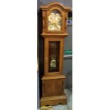 A reproduction oak long case clock with eight-day movement,