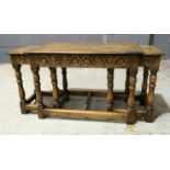 A nest of three reproduction oak occasional tables,