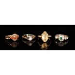 Four assorted stone set rings to include an 18ct illusion set diamond and a coral and seed pearl