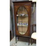 An Edwardian mahogany display cabinet with floral painted detail,