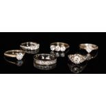 Five silver and cubic zirconia set rings to include a solitaire,