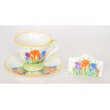 A cup and saucer hand painted by Ethel Barrow with Crocus in the manner of Clarice Cliff hand