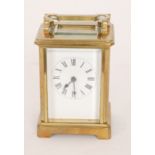 An early 20th Century French brass carriage clock, height 11.5cm (excluding the handle), S/D.