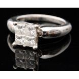 A contemporary 14k white gold diamond four stone ring,