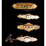 A group of four sweetheart brooches, all stone set, two marked 9ct, and two marked 15ct,