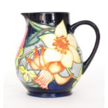 A Moorcroft Pottery water jug decorated in the Golden Jubilee pattern designed by Emma Bossons,