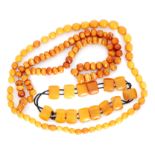 A single unknottted string of natural amber beads comprising of sixty three cushion shaped