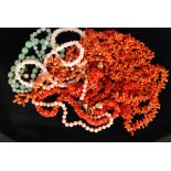 Six rows of assorted coral beads together with a similar graduated single jadite row and a pair of