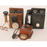 A twin bell walnut cased wall mounted telephone, height 24cm,