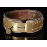 An early 20th Century studded brass and leather adjustable dog collar inscribed J.