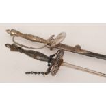 Two late 19th Century Continental fencing foils with raised beadwork and cut floral decoration,