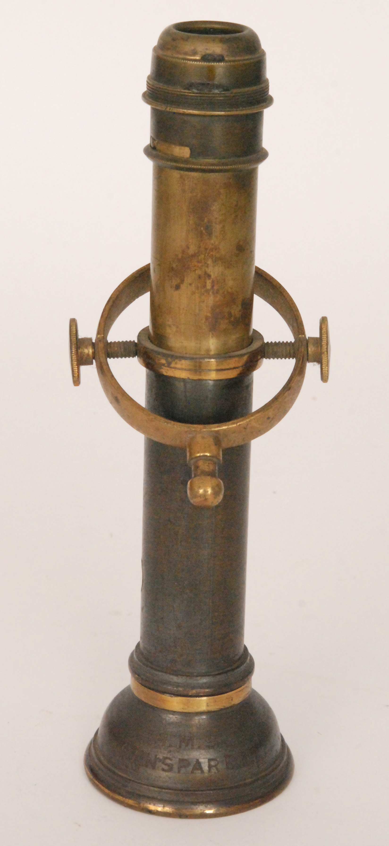 A 19th Century brass ships gimbal candlestick with swivel mount inscribed H.M.