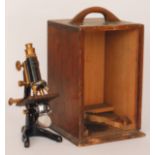 An early 20th Century brass and lacquered microscope named Service by W.