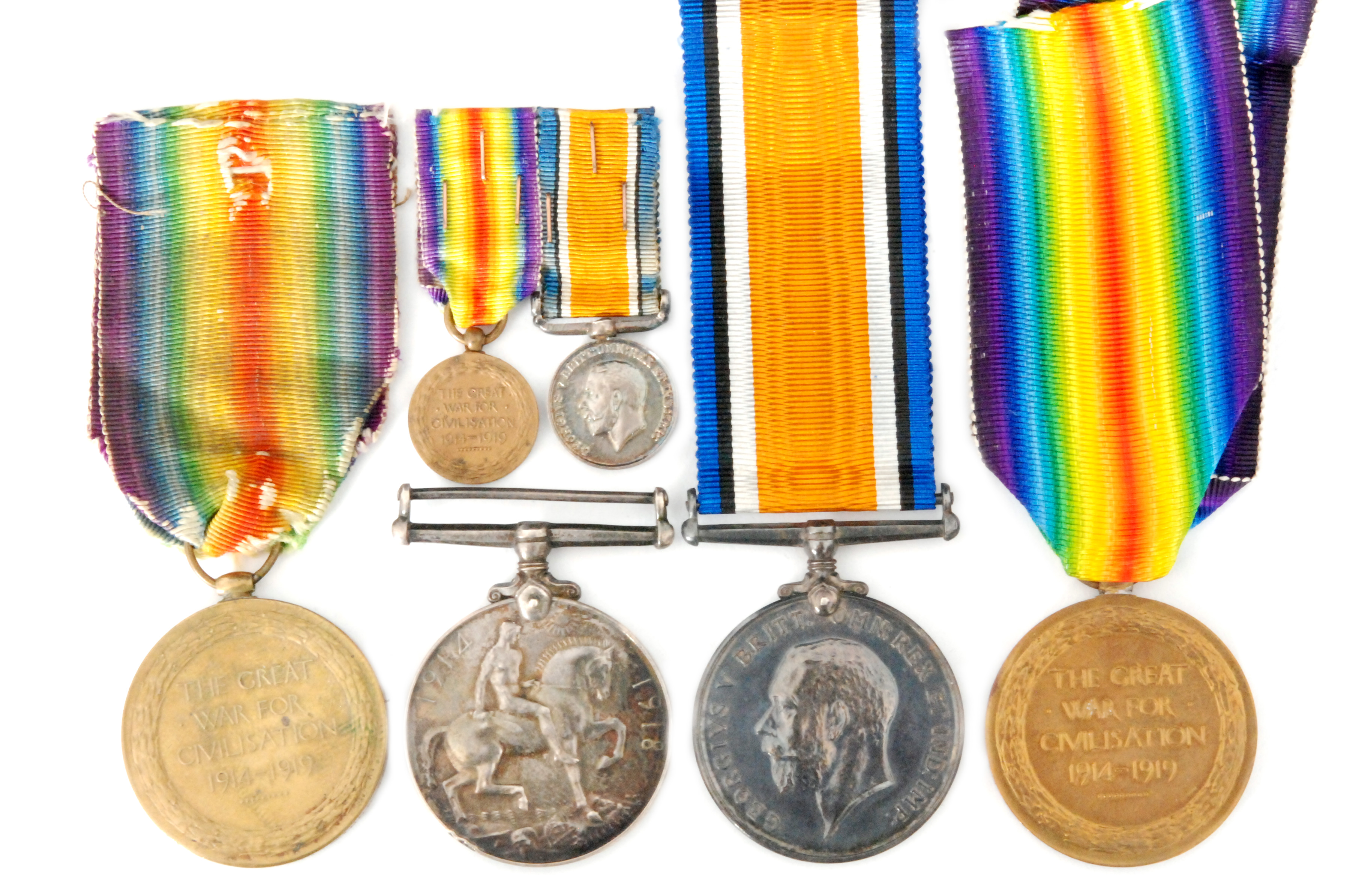 Two First World War medal pairs (British War & Victory) to 392 Gnr N Thomson A 1 Battery (worn) and