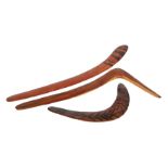 Three mid 20th Century boomerangs, to include a swan neck example.