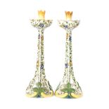 A pair of late 19th to early 20th Century Faience candlesticks, possibly French,