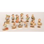 Twelve assorted Goebel Hummel figures comprising Apple Tree Boy, Just Resting, Apple Tree Girl,